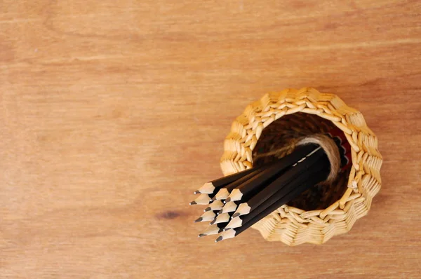 Pencils tied with a rope of straw and place in a container — Stock Photo, Image