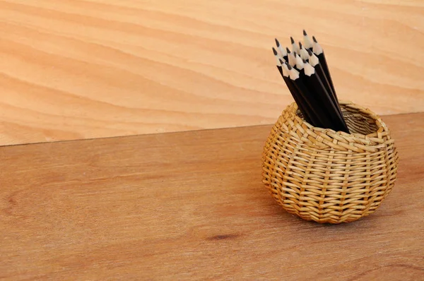 Pencils tied with a rope of straw and place in a container — Stock Photo, Image