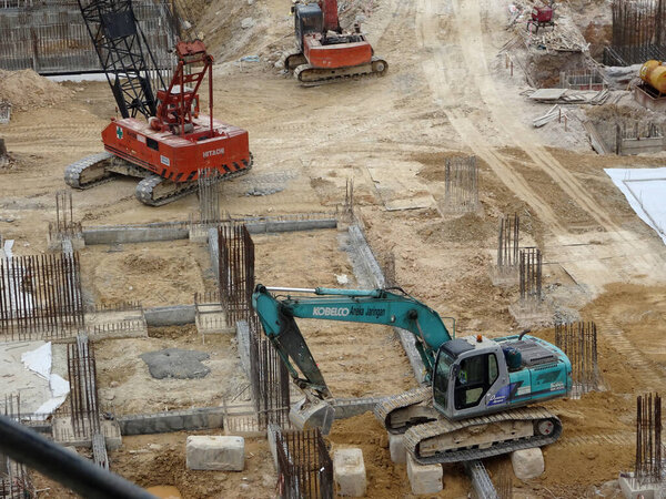 KUALA LUMPUR, MALAYSIA -JULY 17, 2017: Heavy construction machines doing building foundation works at the construction site.  