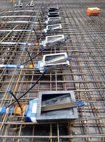 KUALA LUMPUR, MALAYSIA -MAY 14, 2018: Pre-stress cable tendons and anchor part of the pre-stressed concrete. It is a construction technology to get better concrete slab quality with larger span.  