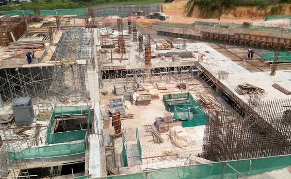 Steel reinforced concrete column under construction. It is as part of building structure at the construction site. Reinforcement bar on top of column ready for the next stage of construction.