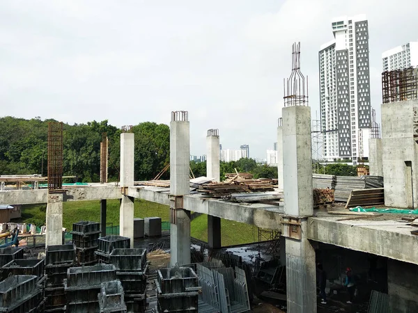 Steel reinforced concrete column under construction. It is as part of building structure at the construction site. Reinforcement bar on top of column ready for the next stage of construction.