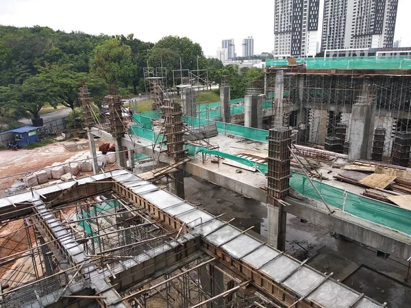 Steel reinforced concrete column under construction. It is as part of building structure at the construction site. Reinforcement bar on top of column ready for the next stage of construction.