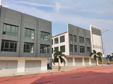 KUALA LUMPUR, MALAYSIA - AUGUST 04, 2019: Multy-story terrace shop lots facade at the commercial area. The shop lot facade designed with beautiful design to attract buyer and customer.  