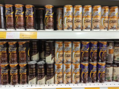 KUALA LUMPUR, MALAYSIA -MARCH 11, 2019: Coffee drinks in many flavours in aluminium cans. It comes in many brands. Some are mixed with cream as a seasoning. On display for sale on supermarket shelves.