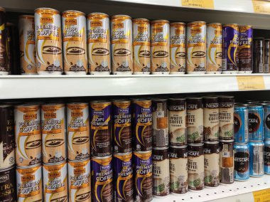KUALA LUMPUR, MALAYSIA -MARCH 11, 2019: Coffee drinks in many flavours in aluminium cans. It comes in many brands. Some are mixed with cream as a seasoning. On display for sale on supermarket shelves.