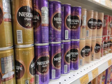 KUALA LUMPUR, MALAYSIA -MARCH 11, 2019: Coffee drinks in many flavours in aluminium cans. It comes in many brands. Some are mixed with cream as a seasoning. On display for sale on supermarket shelves.