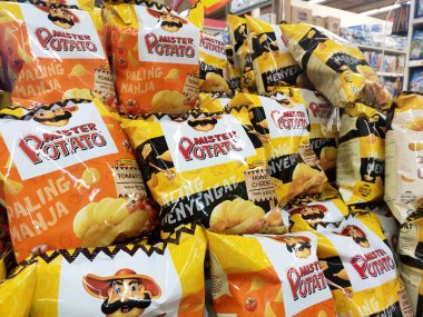 KUALA LUMPUR, MALAYSIA -FEBRUARY 17, 2020: Potato chips or potato chips form Mr Potato brands in commercial pacaging. Display for sale to customer in the supermarket. 