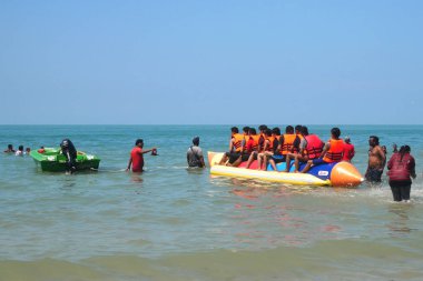 PORT DICKSON, MALAYSIA -JANUARY 1, 2020: Banana boat for rentals at Port Dickson, Malaysia. It is one of the most popular group recreation activities here.