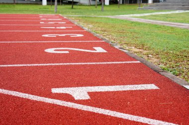 KUALA LUMPUR, MALAYSIA -APRIL 27, 2019: Outdoor running track or athlete track. Orange brick color.  