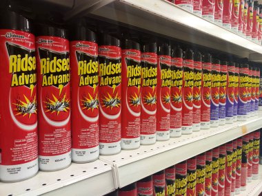 KUALA LUMPUR, MALAYSIA -MARCH 3, 2020: Selective focused of insecticides in cans and displayed on shelves for sale in the supermarket. Separated by the brand to facilitate buyers.