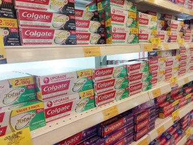 KUALA LUMPUR, MALAYSIA -DECEMBER 09, 2019: The toothpaste is in the box and is displayed on the shelf sorted by brand and type. This makes it easy for buyers to choose from.