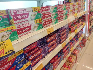 KUALA LUMPUR, MALAYSIA -DECEMBER 09, 2019: The toothpaste is in the box and is displayed on the shelf sorted by brand and type. This makes it easy for buyers to choose from.