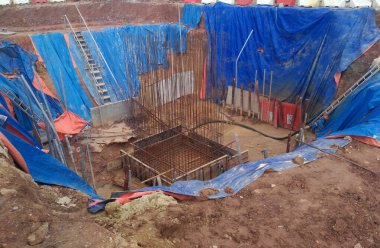 KUALA LUMPUR, MALAYSIA -JULY 16, 2016: Building foundation work at the construction site in Kuala Lumpur, Malaysia. Formwork fabricated using timber formwork by construction workers.  