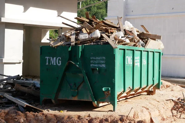 KUALA LUMPUR, MALAYSIA -MARCH 3, 2020: Huge wasted disposal bin used to collect rubbish and unused material from the construction site. Has a fixed collection schedule