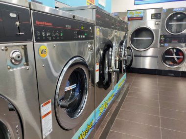 KUALA LUMPUR, MALAYSIA -MARCH 14, 2020: Laundry machines. This outlet provides self-service laundry and drying machines. Open 24 hours.