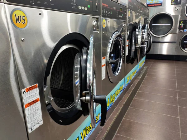 KUALA LUMPUR, MALAYSIA -MARCH 14, 2020: Laundry machines. This outlet provides self-service laundry and drying machines. Open 24 hours.