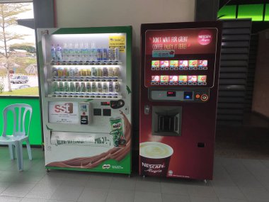 KUALA LUMPUR, MALAYSIA -MARCH 16, 2020: The vending machines sell a wide variety of drinks by self-service methods. Placed strategically to attract customers.
