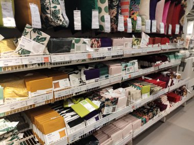 SEREMBAN, MALAYSIA -MARCH 16, 2020: Selected focused of pillows and cushion covers of various colors are on sale. Some of them were hung in size and some were put in large metal boxes.