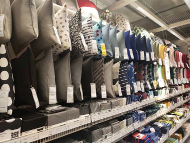 SEREMBAN, MALAYSIA -MARCH 16, 2020: Selected focused of pillows and cushion covers of various colors are on sale. Some of them were hung in size and some were put in large metal boxes.