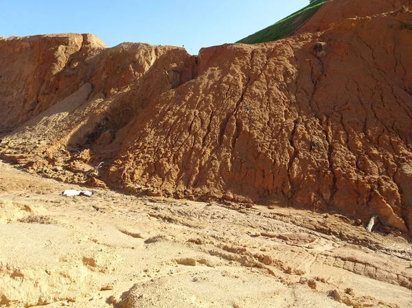 Erosion at ground and slopes is caused by rainfall. The soil structure is weak and there are landslide. Safety measure has been taken in some area.