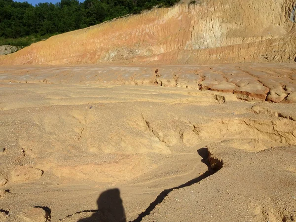 Erosion at ground and slopes is caused by rainfall. The soil structure is weak and there are landslide. Safety measure has been taken in some area.