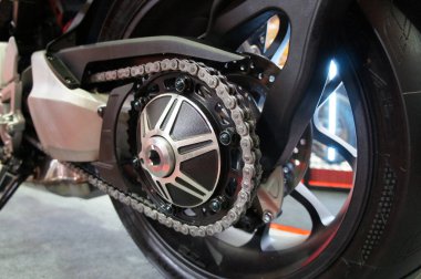 KUALA LUMPUR, MALAYSIA -APRIL 1, 2019: Motorcycle chain. It is a metallic chain that is used to transmit power from the engine to the rear wheel. clipart