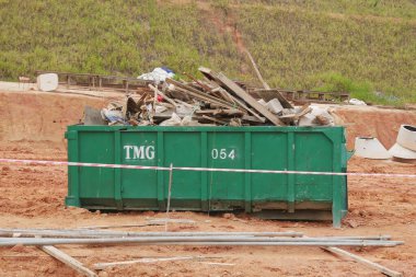 KUALA LUMPUR, MALAYSIA -MARCH 3, 2020: Huge wasted disposal bin used to collect rubbish and unused material from the construction site. Has a fixed collection schedule