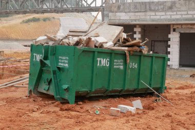 KUALA LUMPUR, MALAYSIA -MARCH 3, 2020: Huge wasted disposal bin used to collect rubbish and unused material from the construction site. Has a fixed collection schedule