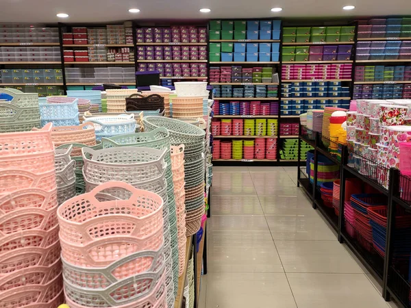 Small plastic containers for sale inside the supermarket. It comes in a variety of sizes,  design and colours to meet its purpose.