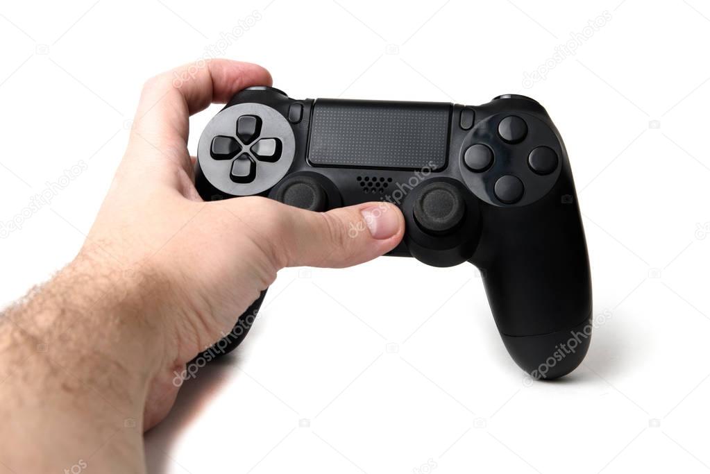 Hand holding video game controller isolated on white background