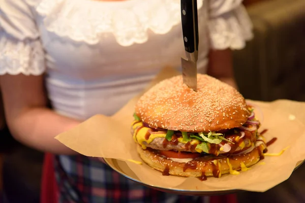 Hamburger served by waitress