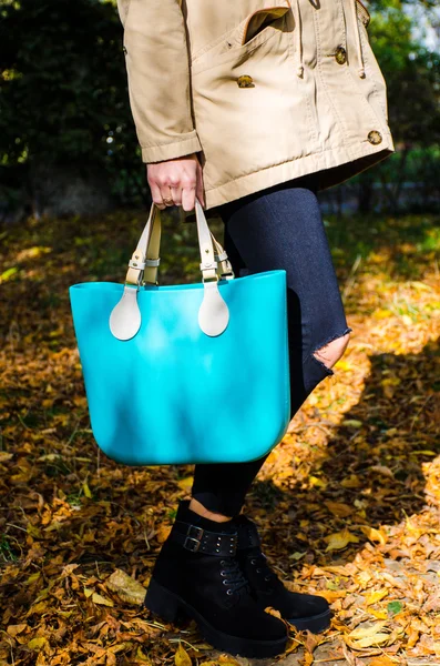 Woman with aqua bag