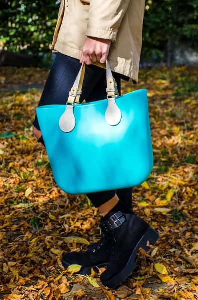 Woman with aqua bag