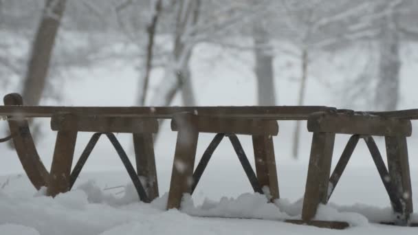 Snowing on Wood Sleigh — Stock Video