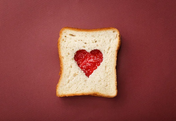 Two pieces of toast bread stacked in a sandwich.