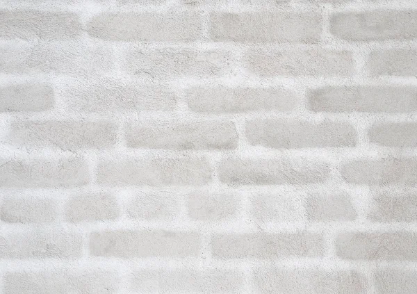 Verputzte Wand mit Silhouetten aus Ziegeln — Stockfoto