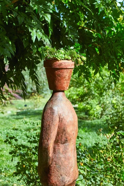 Statue with a flower pot instead of a head Stock Picture