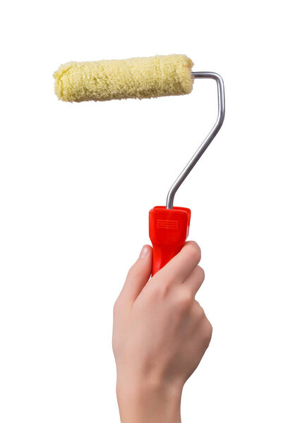 New paint roller in a male hand in a vertical shot isolated on white backgroun