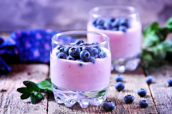 Homemade smoothies from organic blueberries on the old wooden background. — ストック写真