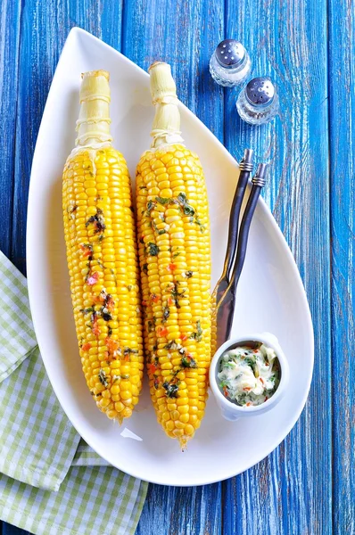 Corn baked in foil with butter, garlic, chili, coriander and sea salt. — Stock Photo, Image