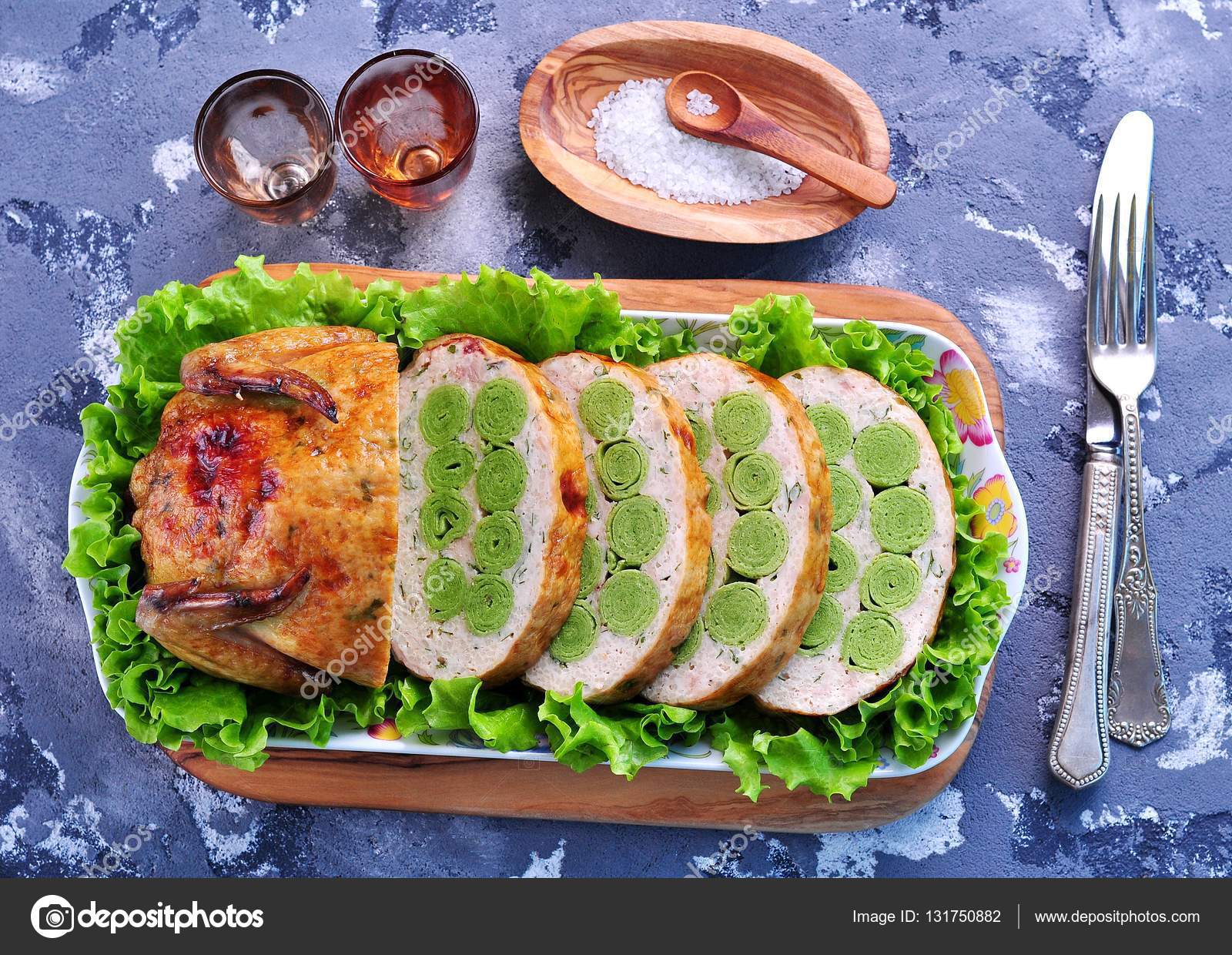 Baked chicken stuffed with spinach pancakes, couscous and parsley