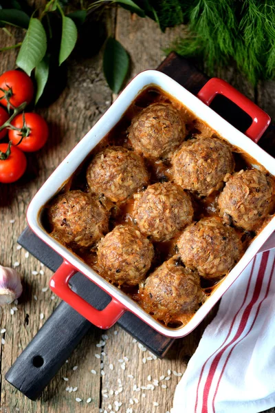 Beef meat balls with rice baked in tomato sauce. — Stock Photo, Image