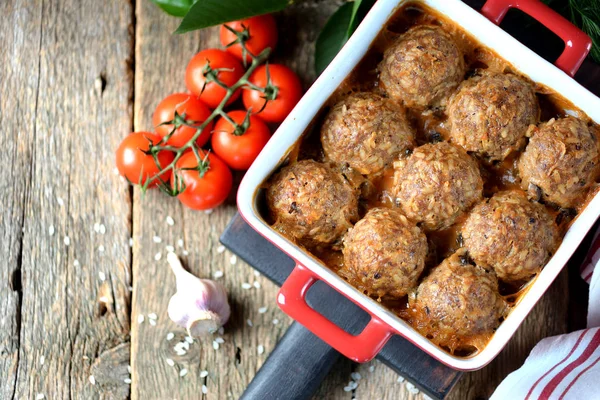 Beef meat balls with rice baked in tomato sauce. — Stock Photo, Image