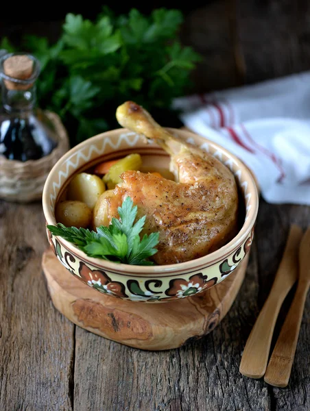 Chicken leg baked with potatoes, carrots, celery and onions. — Stock Photo, Image