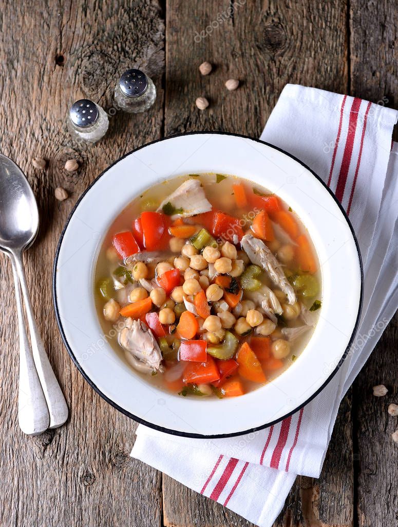 Soup with chicken, chickpeas, sweet peppers, onions, carrots, celery