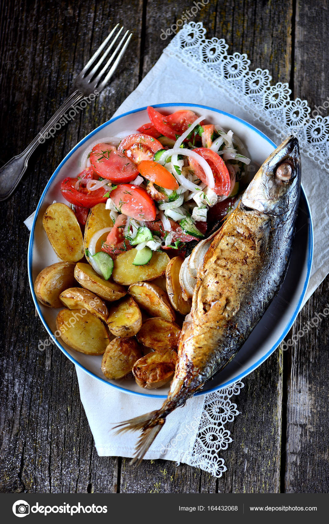 Mackerel baked with baby potatoes, rosemary, dill and parsley, sweet