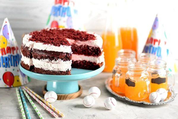 Homemade cake Red Velvet on a wooden background. Birthday party.