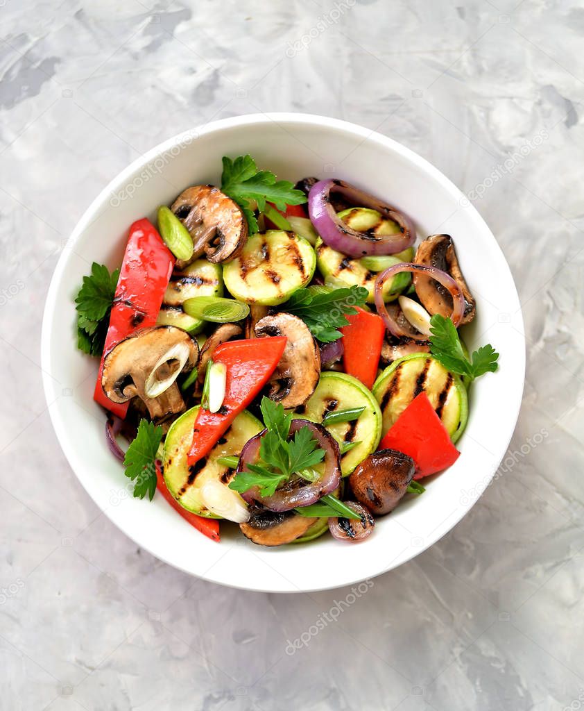 Grilled vegetables - zucchini, portobello mushrooms, red pepper, red onion, green onion, garlic, olive oil, wine vinegar, sea salt and parsley. Healthy food.