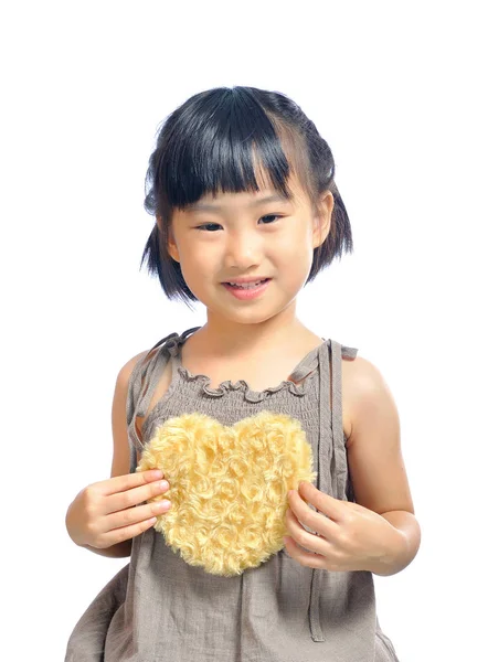 Азіатські маленька дівчинка тримає мішечок серця — стокове фото